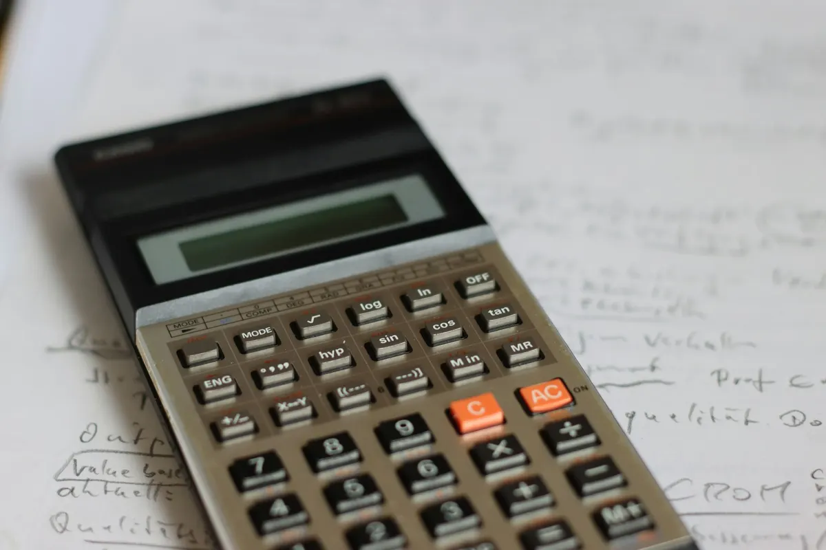 Calculator on a sheet of handwritten notes